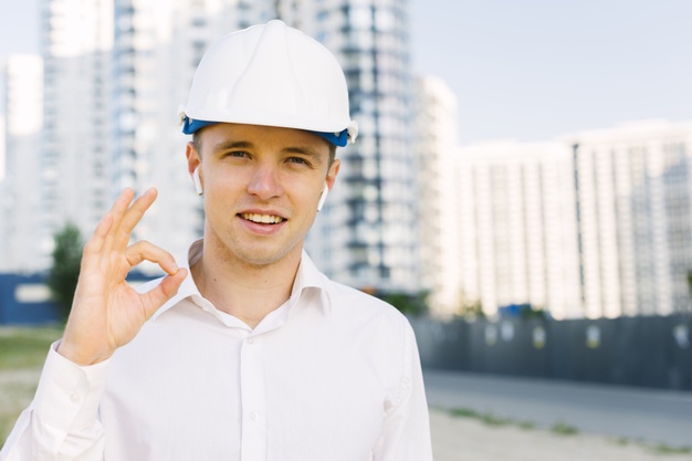 front-view-happy-man-with-helmet-showing-approval_23-2148269260